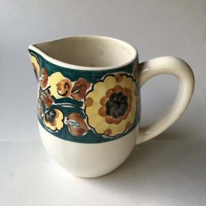 Keramik mlkekande med blomsterdecor